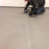 white sealant being poured
