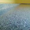 dark grey epoxy floor with decorative flakes